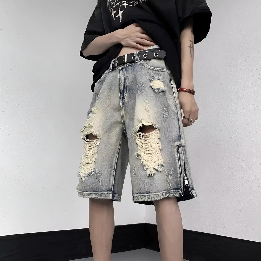 Blue retro denim shorts with tattered detailing and a wide leg loose fit