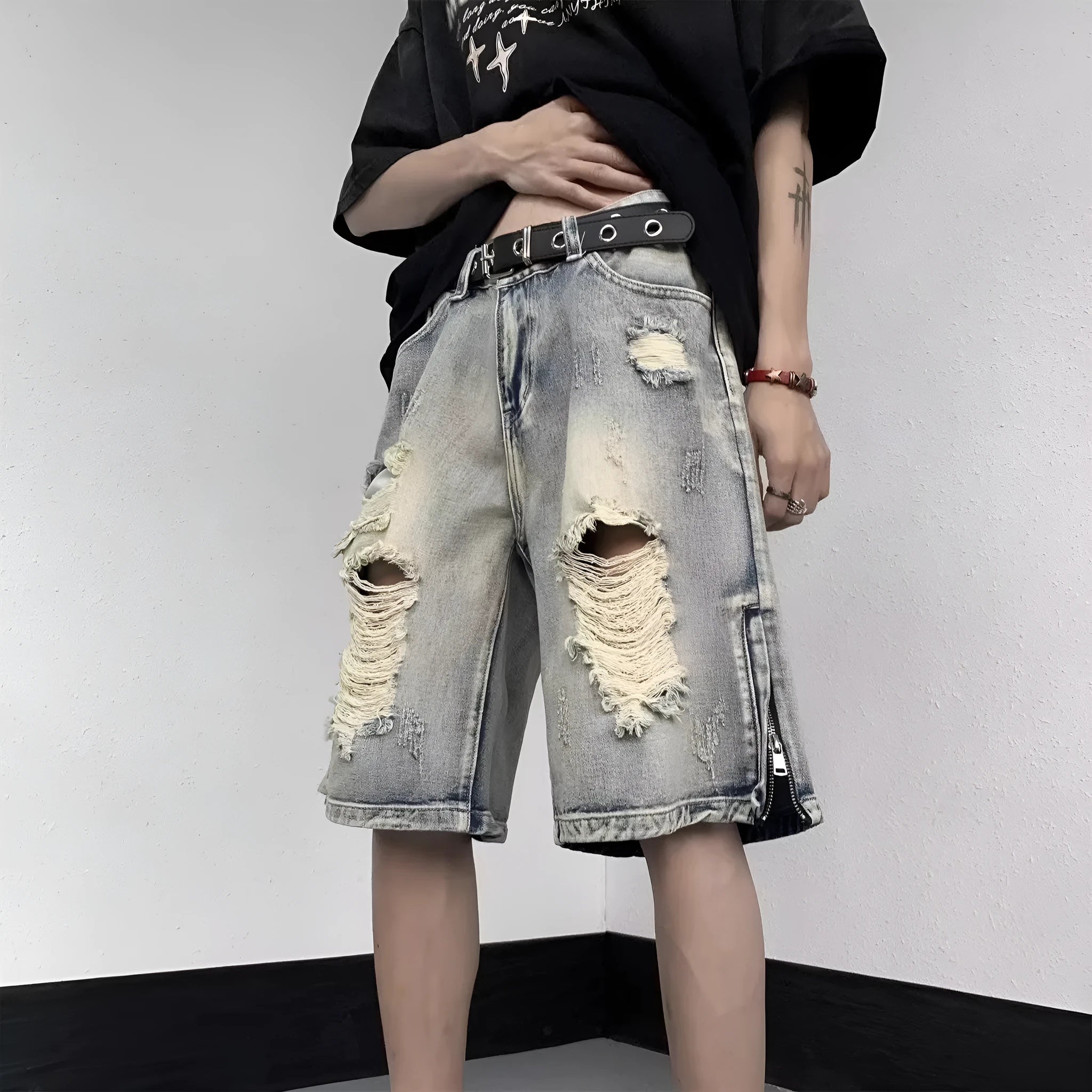 Blue retro denim shorts with tattered detailing and a wide leg loose fit