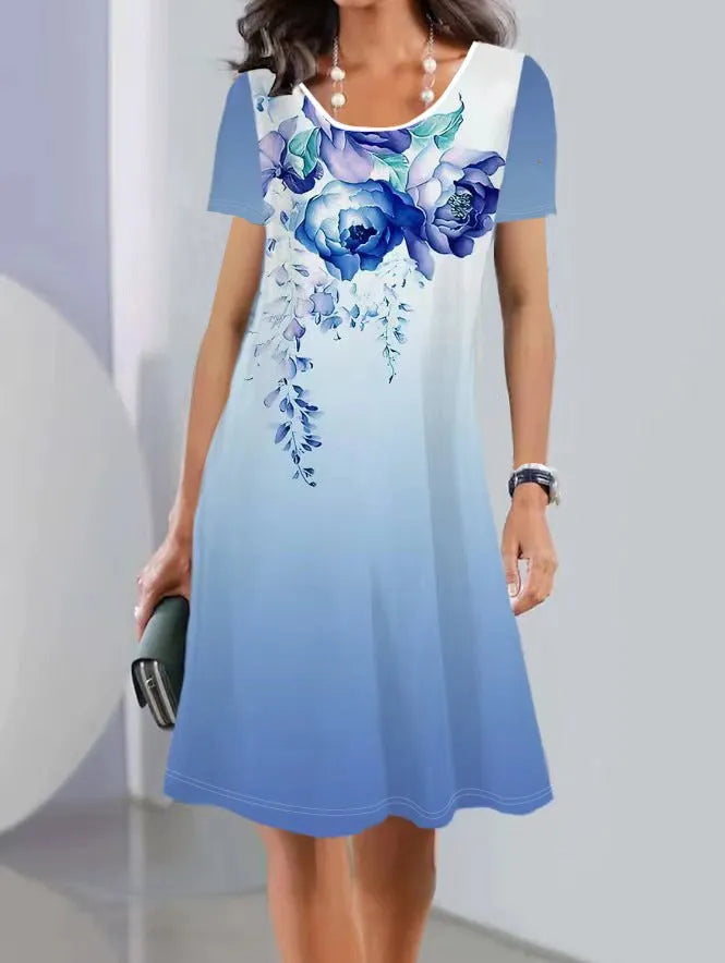 Light blue floral print summer dress with short sleeves and an A-line mid-length skirt on a hanger
