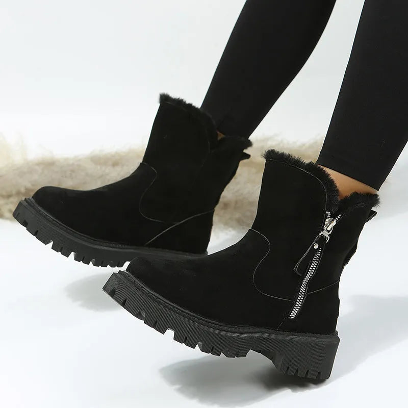 Women's black faux suede snow boots with thick plush lining and side zip closure