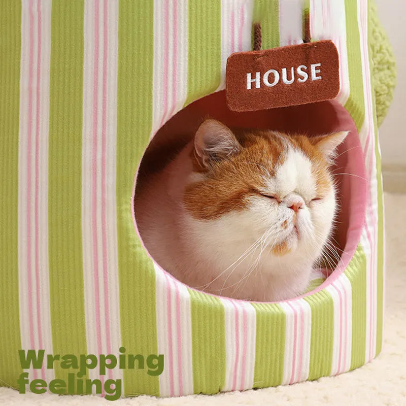 Green cauliflower-shaped enclosed cotton pet house for small dogs or cats on a wooden floor.