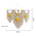 Creamy white hand-woven cotton Nordic tapestry hanging on a wall, 120cm wide by 95cm high.