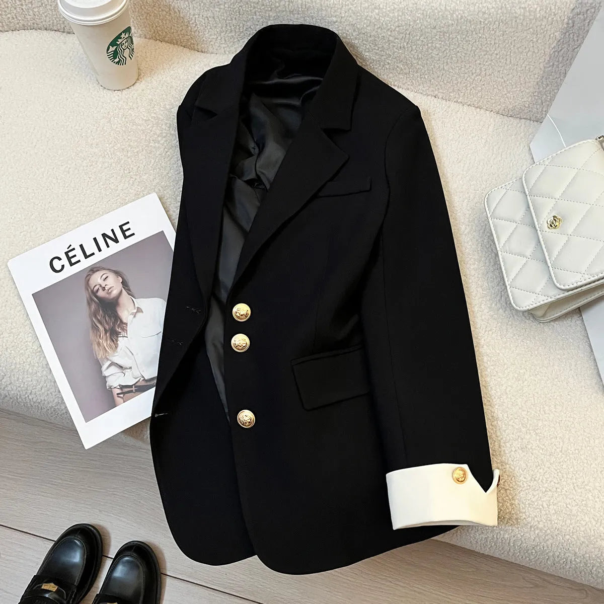 Women's loose-fitting mid-length polyester coat in milky white with pockets.