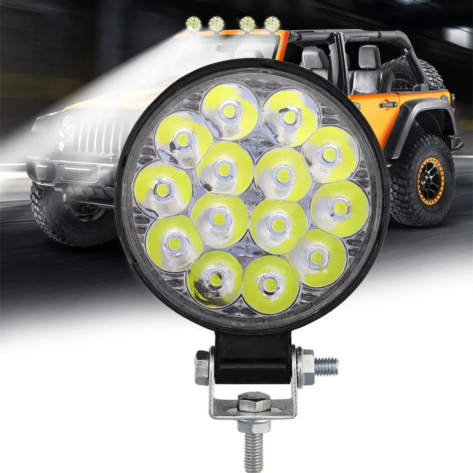 White aluminium mini round 42W LED work light with IP67 waterproof rating for vehicles and machinery.