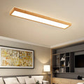 A long, linear solid wood ceiling lamp in New Chinese style, shown in a walnut finish, hanging from a covered balcony ceiling.