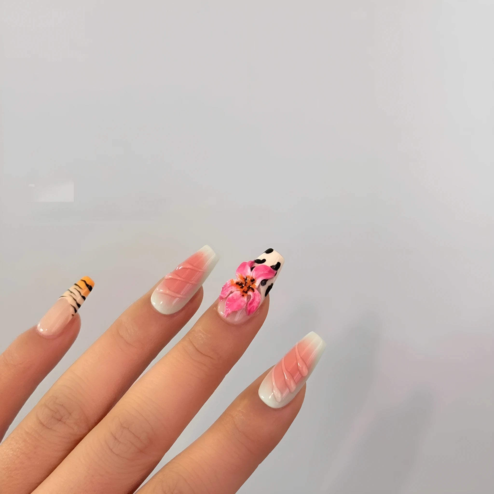 Zebra pattern lily hand carving nail art set showing embossed floral and leopard print designs