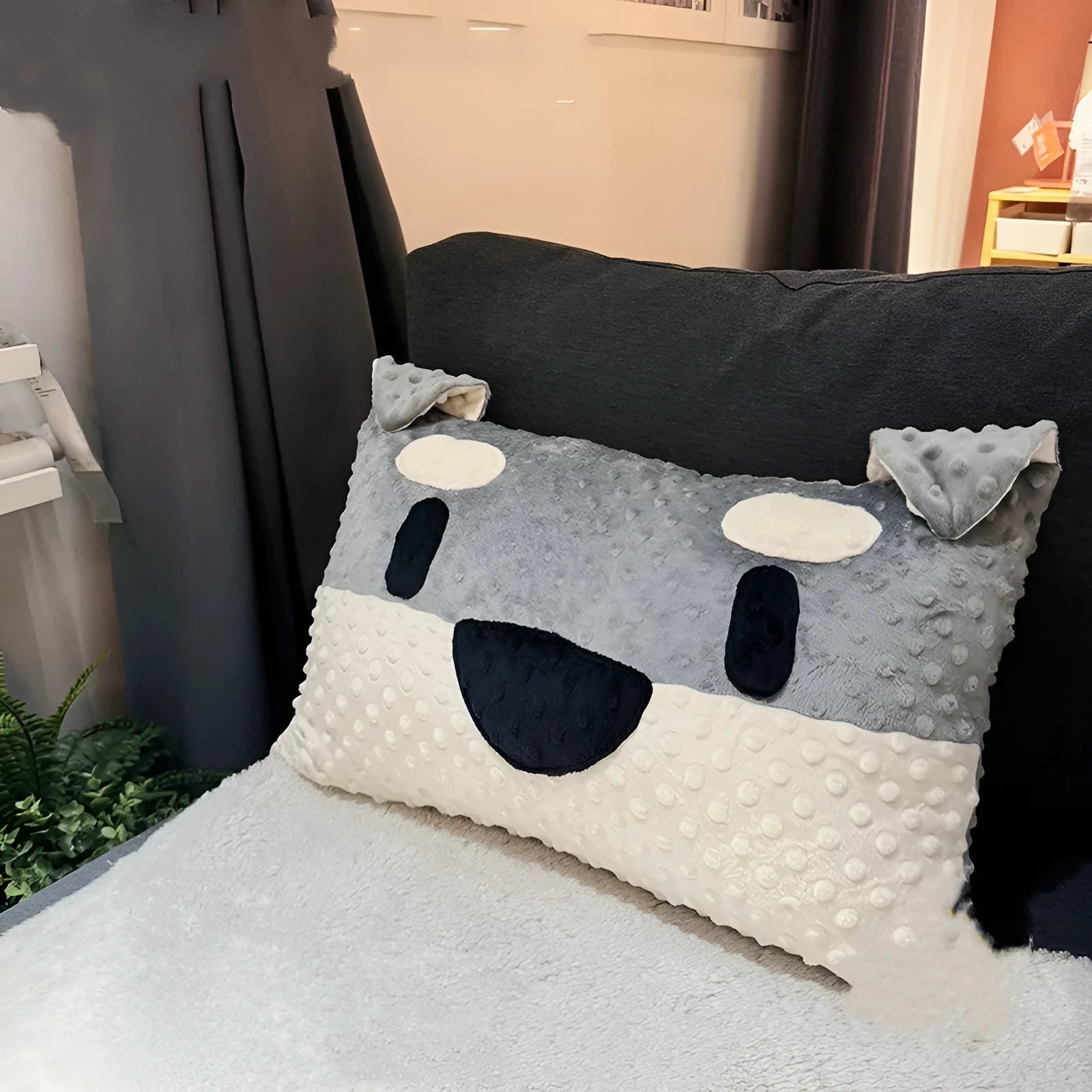 Grey schnauzer design dog pillow cushion on a sofa, showing soft fabric and 50 cm width.