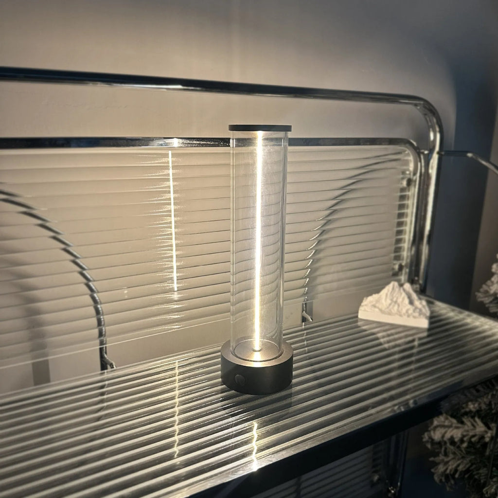 Slender LED glass light strip with magnetic mounting and USB charging cable