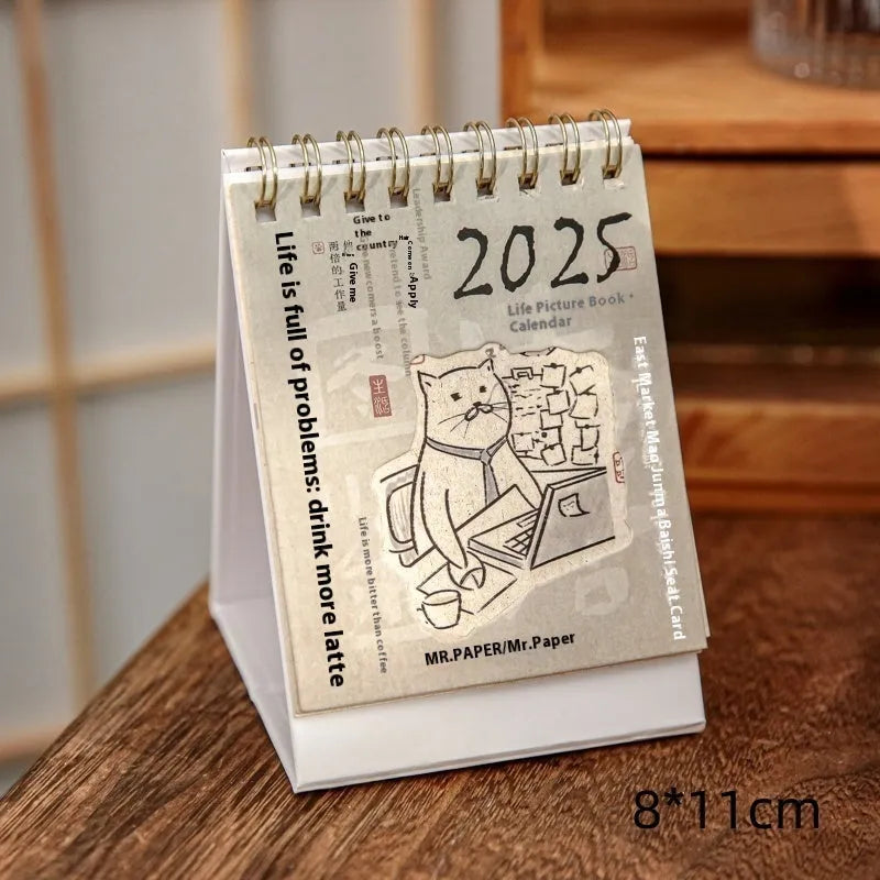 Coffee themed mini desk calendar for 2025 showing four different model designs on a desk.