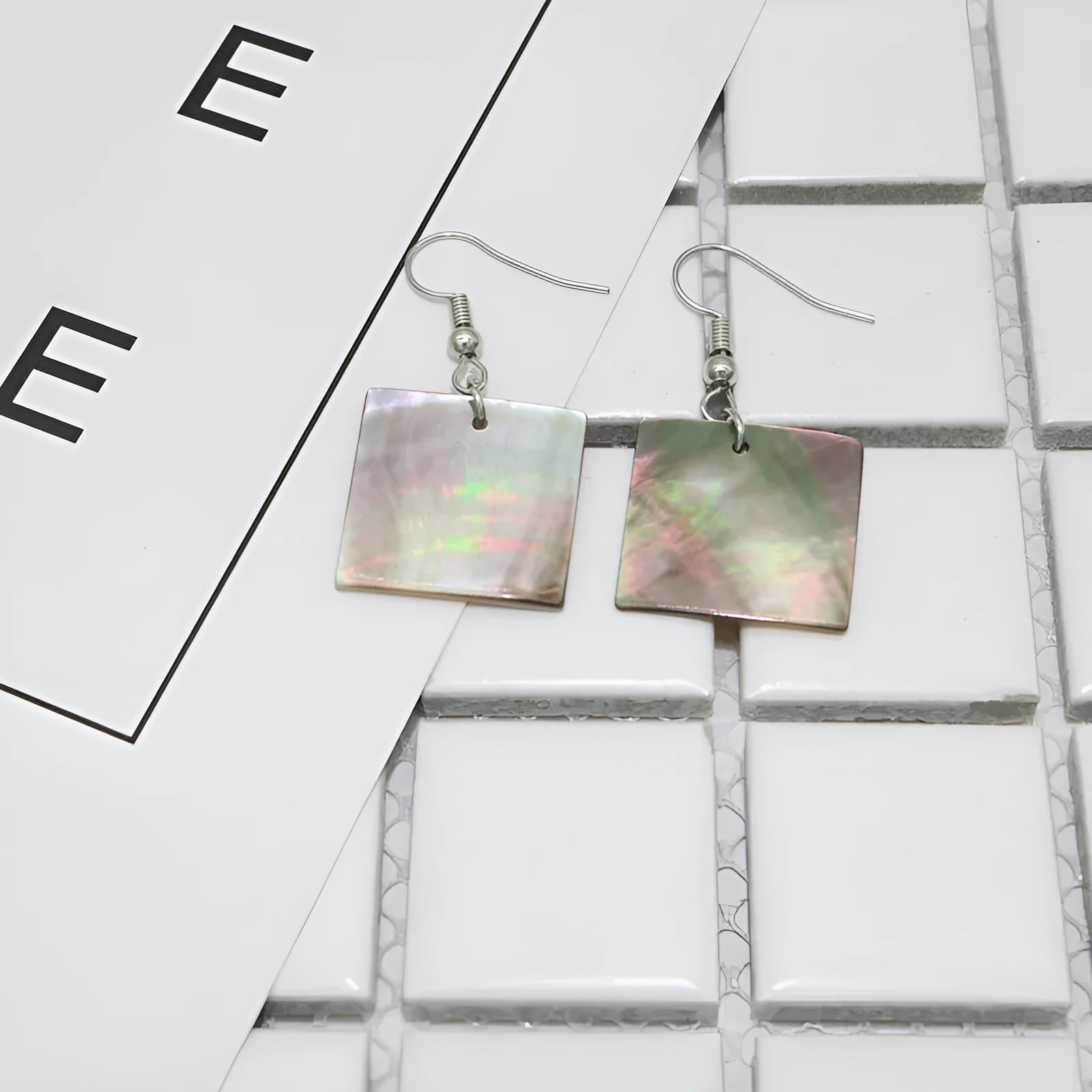 Women's geometric shell earrings in square or rectangular designs with natural patterning