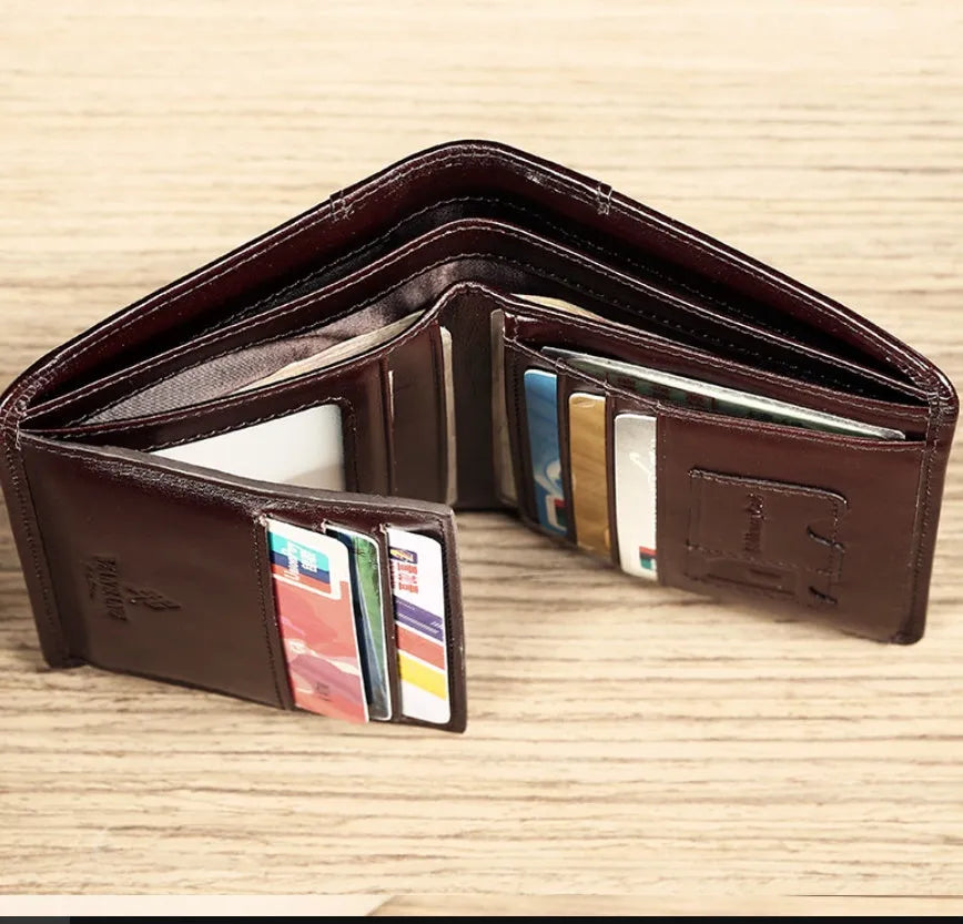 Men's black and coffee brown leather wallet open to show multiple internal card slots, note pocket, and coin compartment.