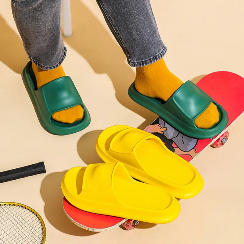 Unisex thickened EVA flip-flop slippers in black with a non-slip sole for bathroom use.