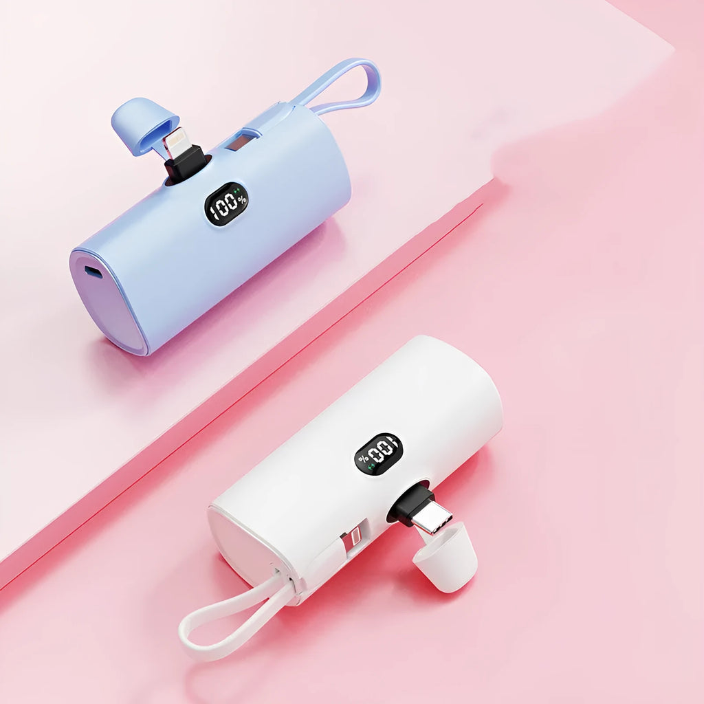 Compact capsule-shaped digital display power bank with integrated USB plug, shown in multiple colours.