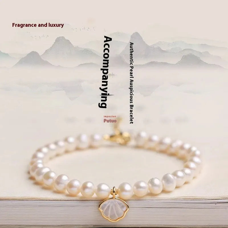 Freshwater pearl bracelet for women with 5-6mm pearls and fan design, available with elastic or chain closure