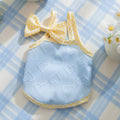 Small dog wearing heart relief texture bow suspenders vest in blue with matching hairband