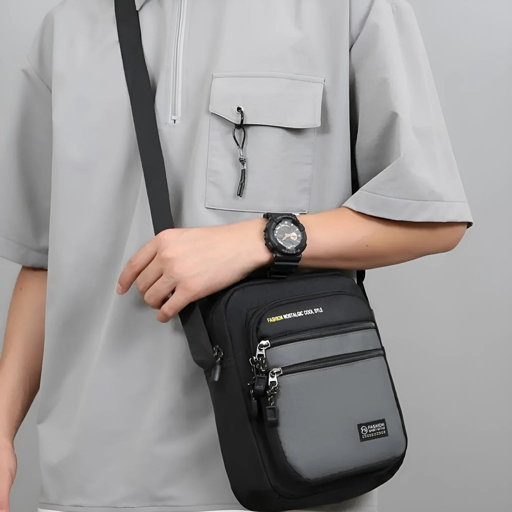 Men's solid colour nylon crossbody bag with adjustable shoulder strap in urban simplicity style.