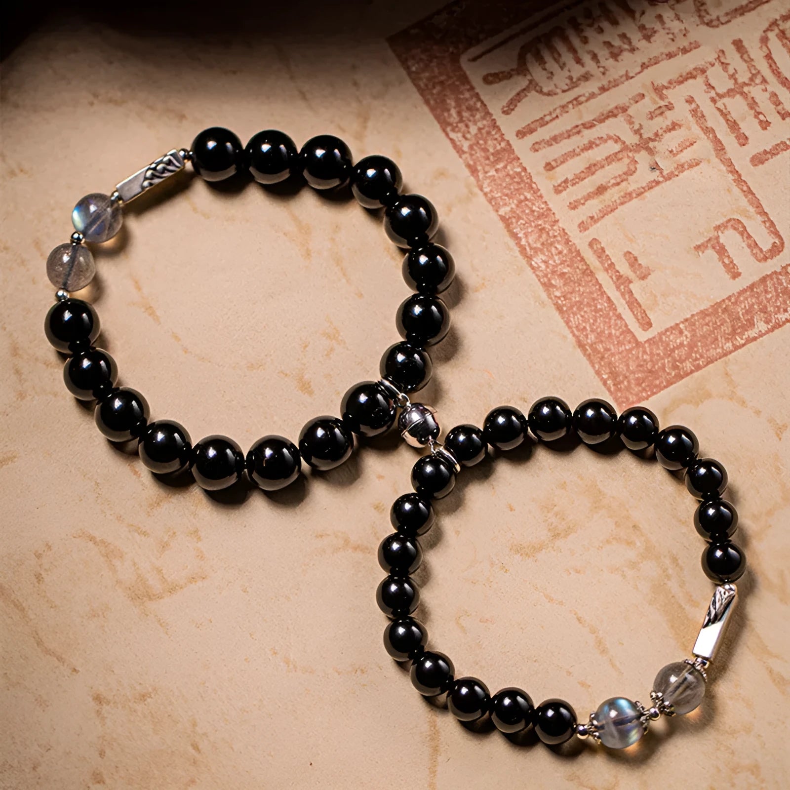 Obsidian Buddha beads couple bracelet DIY set showing 10mm men's and 8mm women's sizes in national style
