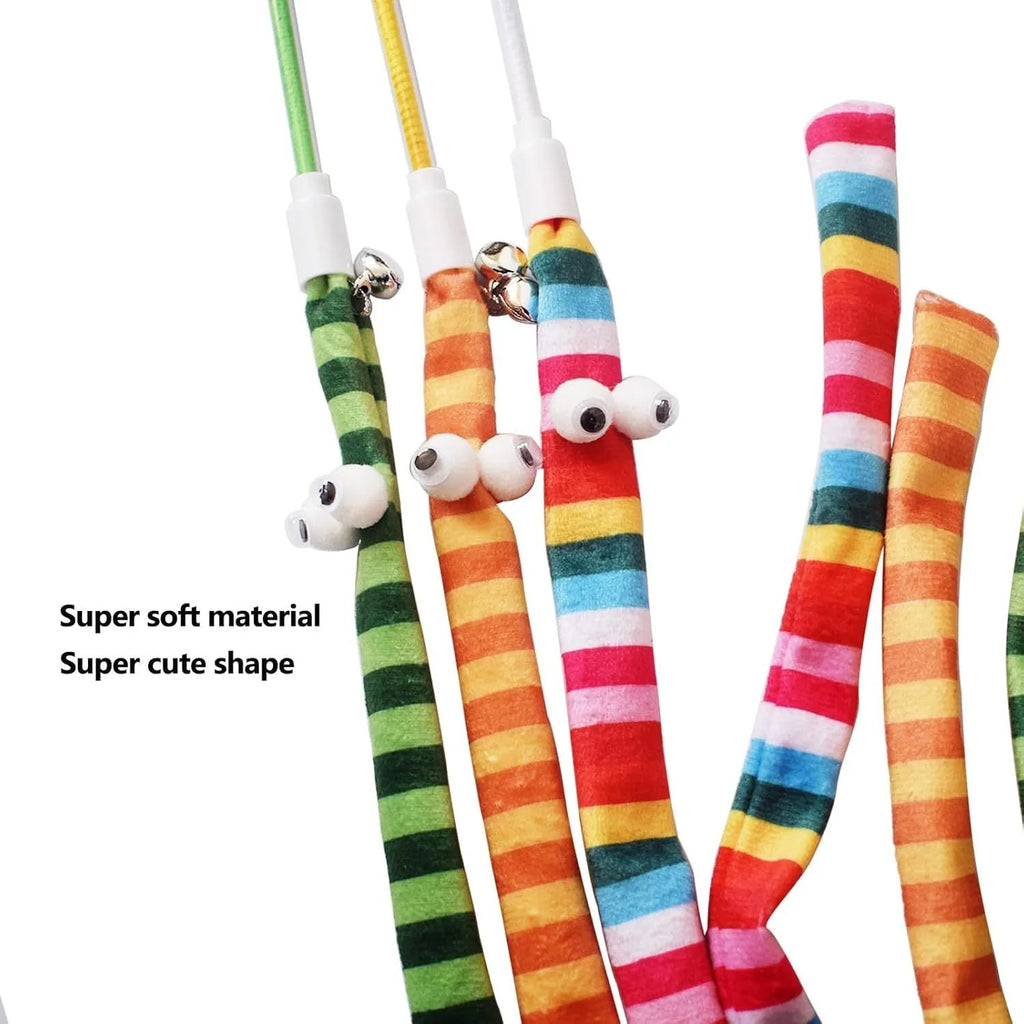Green cat wand toy with long plush strip on a polycarbonate pole, shown mid-swing.