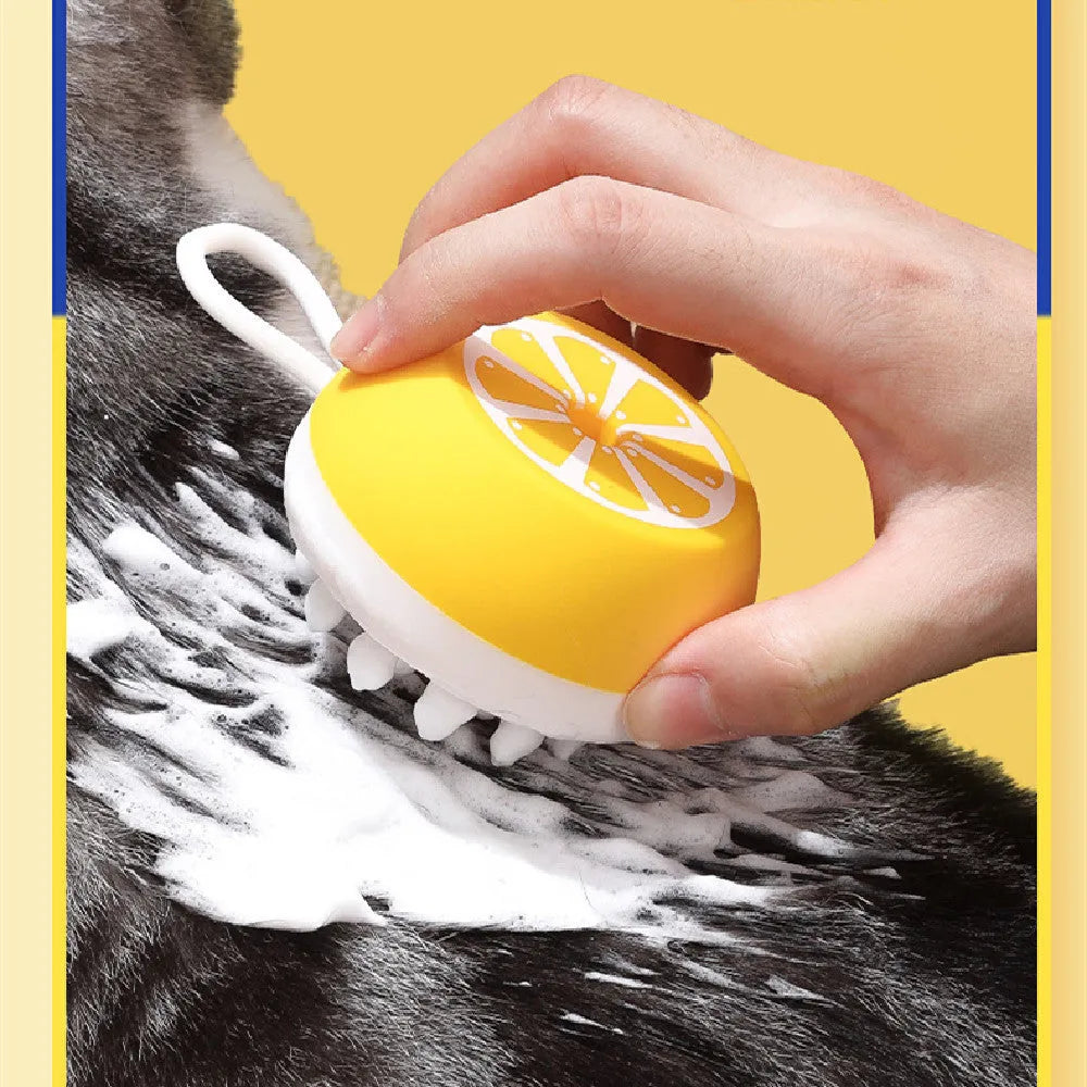 Yellow silicone pet bath brush with massage heads for dog and cat grooming during bath time