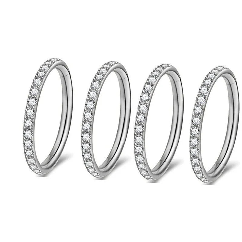 Stainless steel seamless nose ring in round shape showing colour options of black, gold, rose gold, and steel.