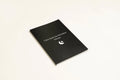 Black A5 hardcover dream journal notebook with elastic closure band.