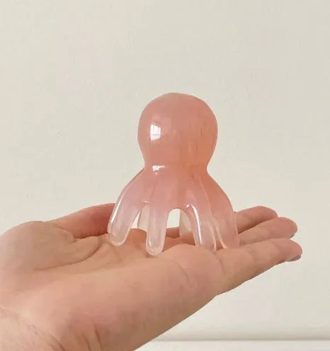 Small pink octopus-shaped massage comb for facial meridian and periocular massage