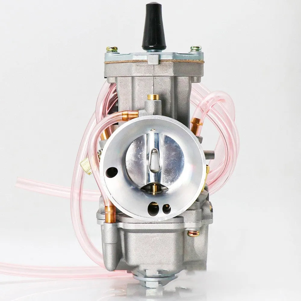 Seven sandblasted PWK motorcycle carburettors in sizes 21mm, 24mm, 26mm, 28mm, 30mm, 32mm, and 34mm.