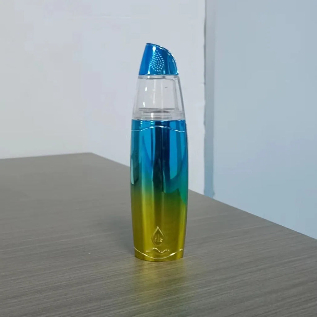 Peacock blue handheld facial steamer with USB charging port and mist spray nozzle