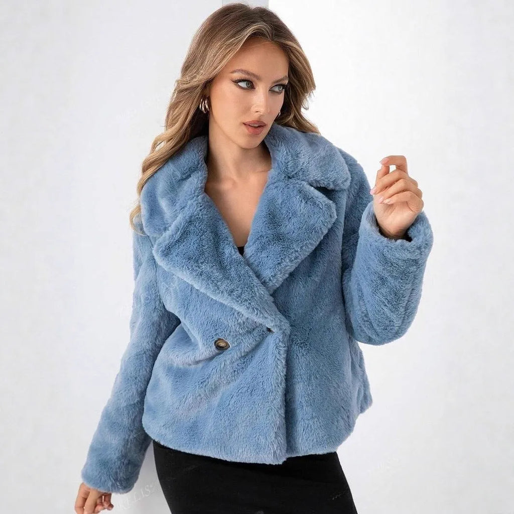 A rose red women's short faux fur coat with a loose fit and regular sleeves on a hanger.