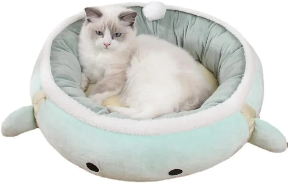 Green dinosaur shaped cat bed with hanging straps shown both flat and as hammock