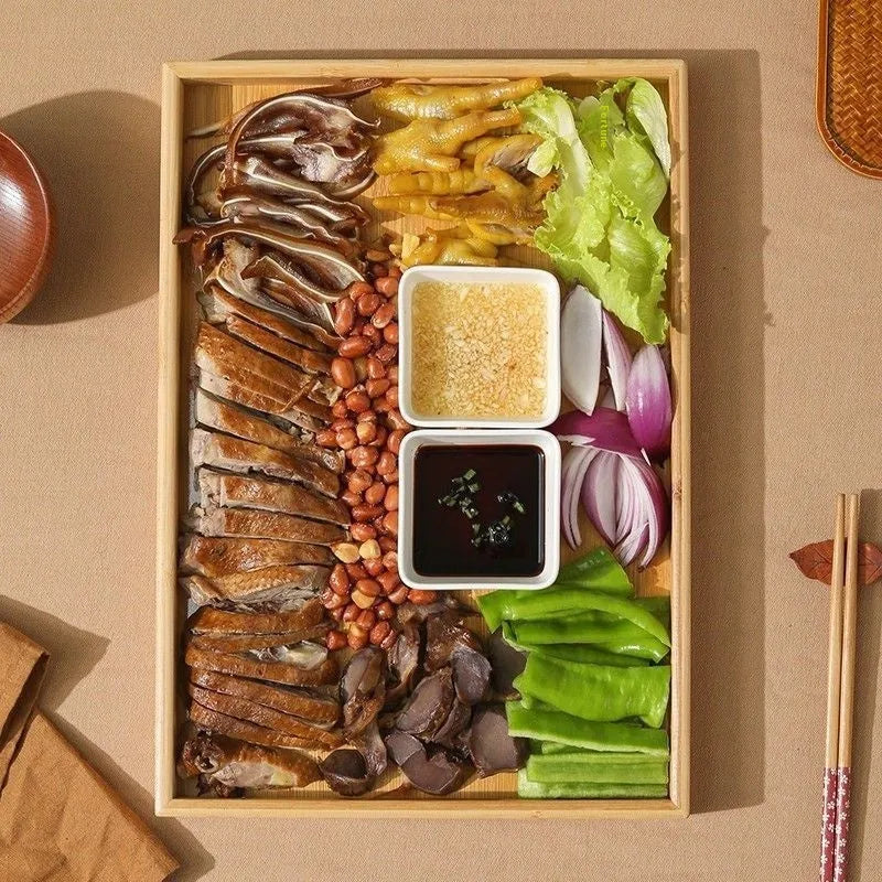 Square bamboo serving tray with brown handle on solid colour background