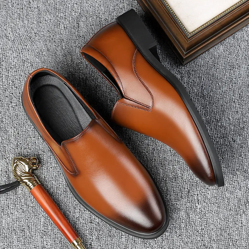 Men's black business casual slip-on shoes with a leather toe cap and sewing line detail.