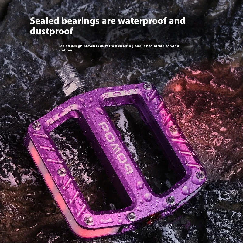 Aluminium alloy bicycle pedals with integrated LED illumination in black purple red gold titanium colour options