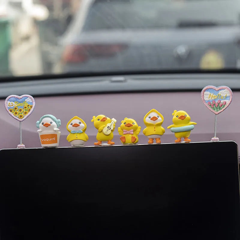 PVC duckling car decoration set with six small duck ornaments and one sign label for dashboard placement