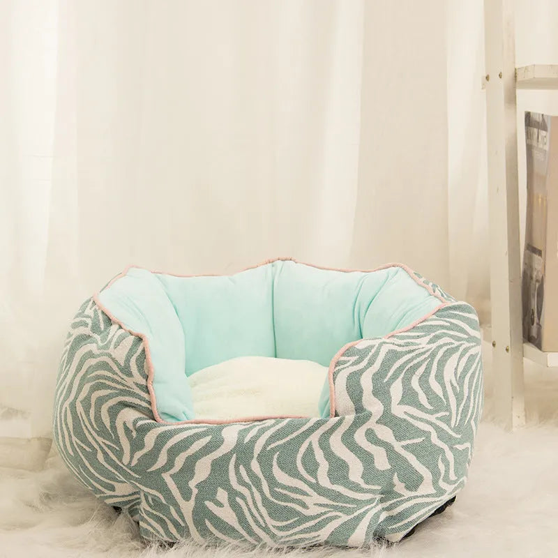 Blue octagonal pet bed with soft wool point design and removable mat for a small dog.