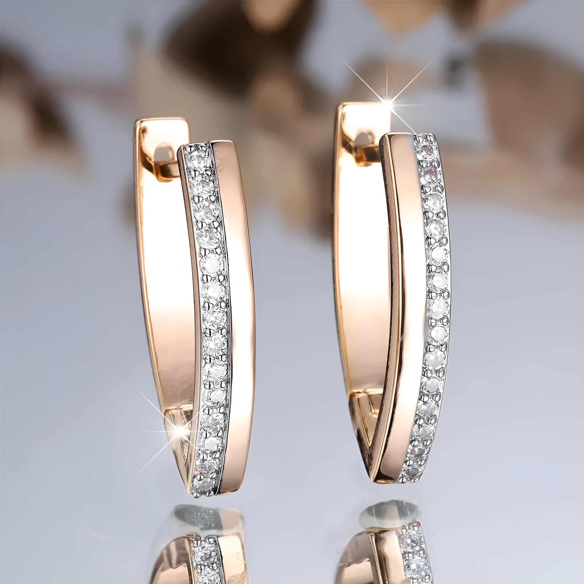 Women's geometric V-shaped ear clips with champagne gold electroplating and white diamond accents
