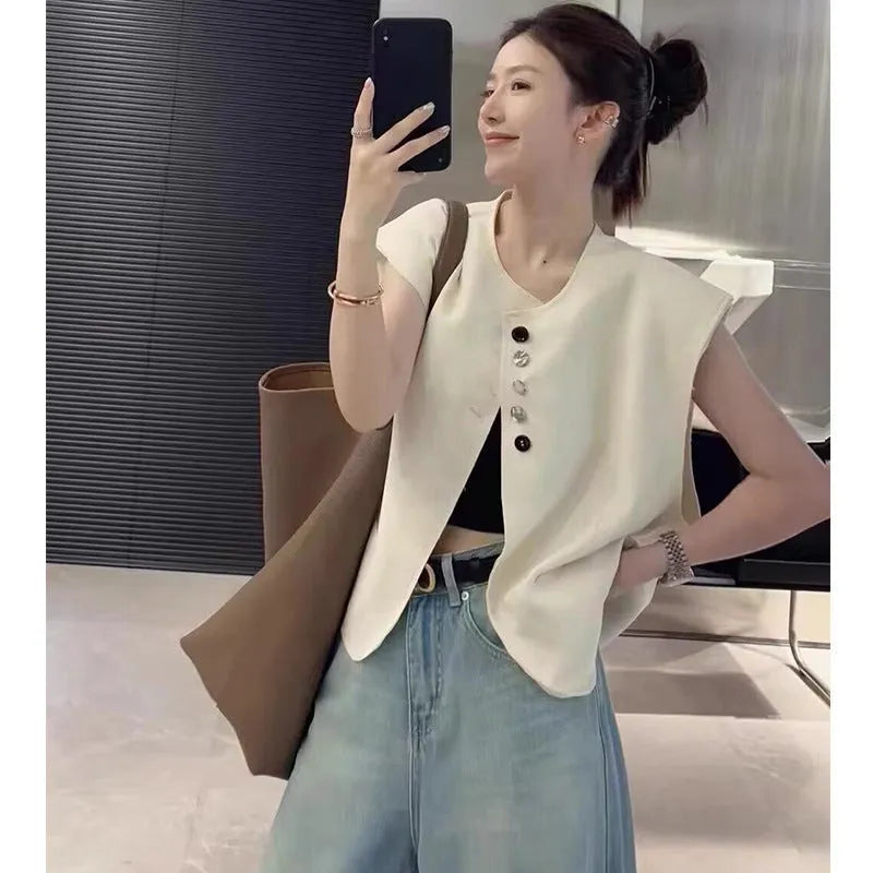 Women's loose-fitting polyester vest with side pockets in milky white colour