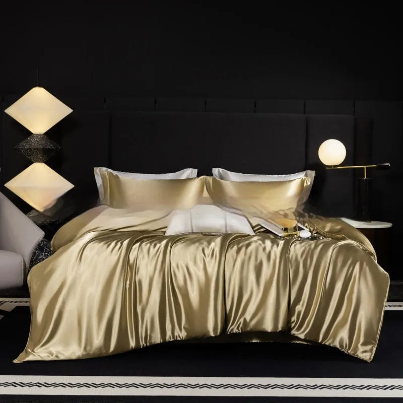 Silk bed sheet four-piece set in a solid colour, shown draped over a bed in one of seven available colours.