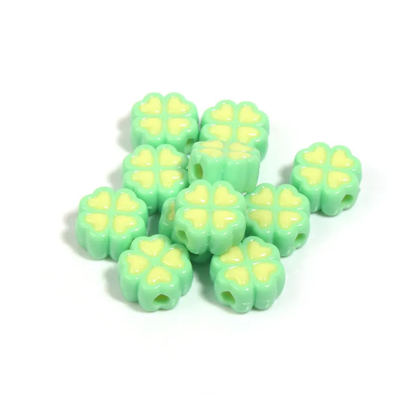 Acrylic clover craft beads with frosted finish in mixed colours including pink, blue and green