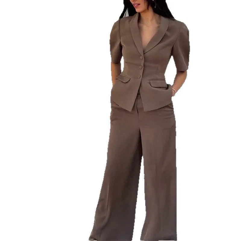 Brown slim fit two-piece polyester suit on a hanger, showing the long sleeve top and trousers.