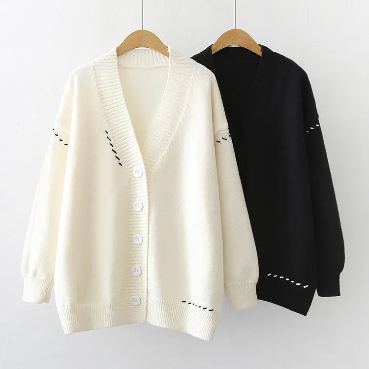 Women's black knitted cardigan coat with long sleeves and loose fit
