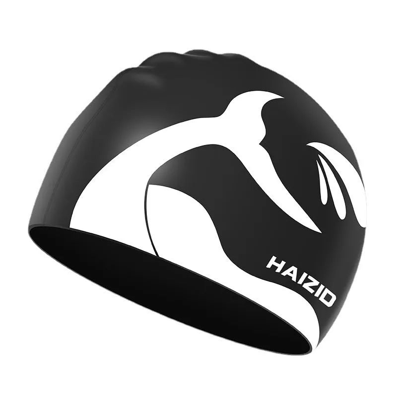 Silicone swimming cap with whale tail pattern and integrated ear protectors in grey.