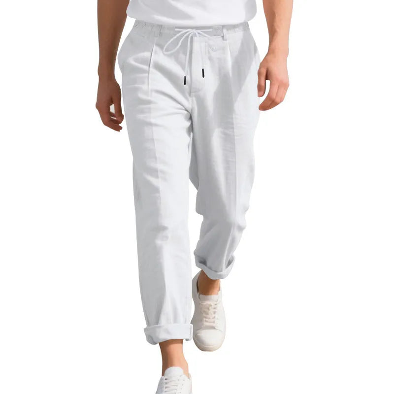 Men's light beige linen casual trousers with a drawstring waist and straight leg on a hanger.