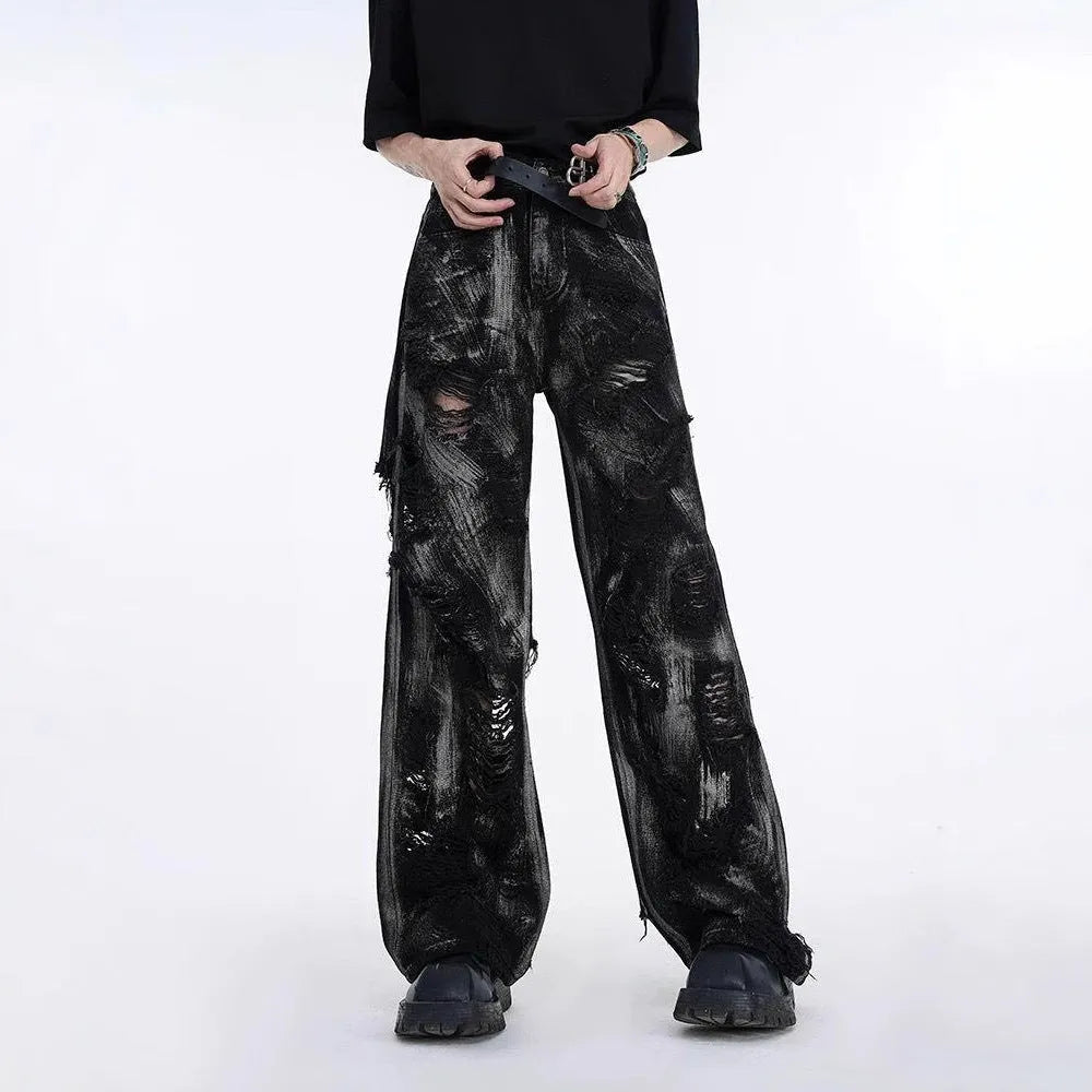 Men's black and grey-pink heavyweight washed denim jacket and jeans set with graffiti style detailing.