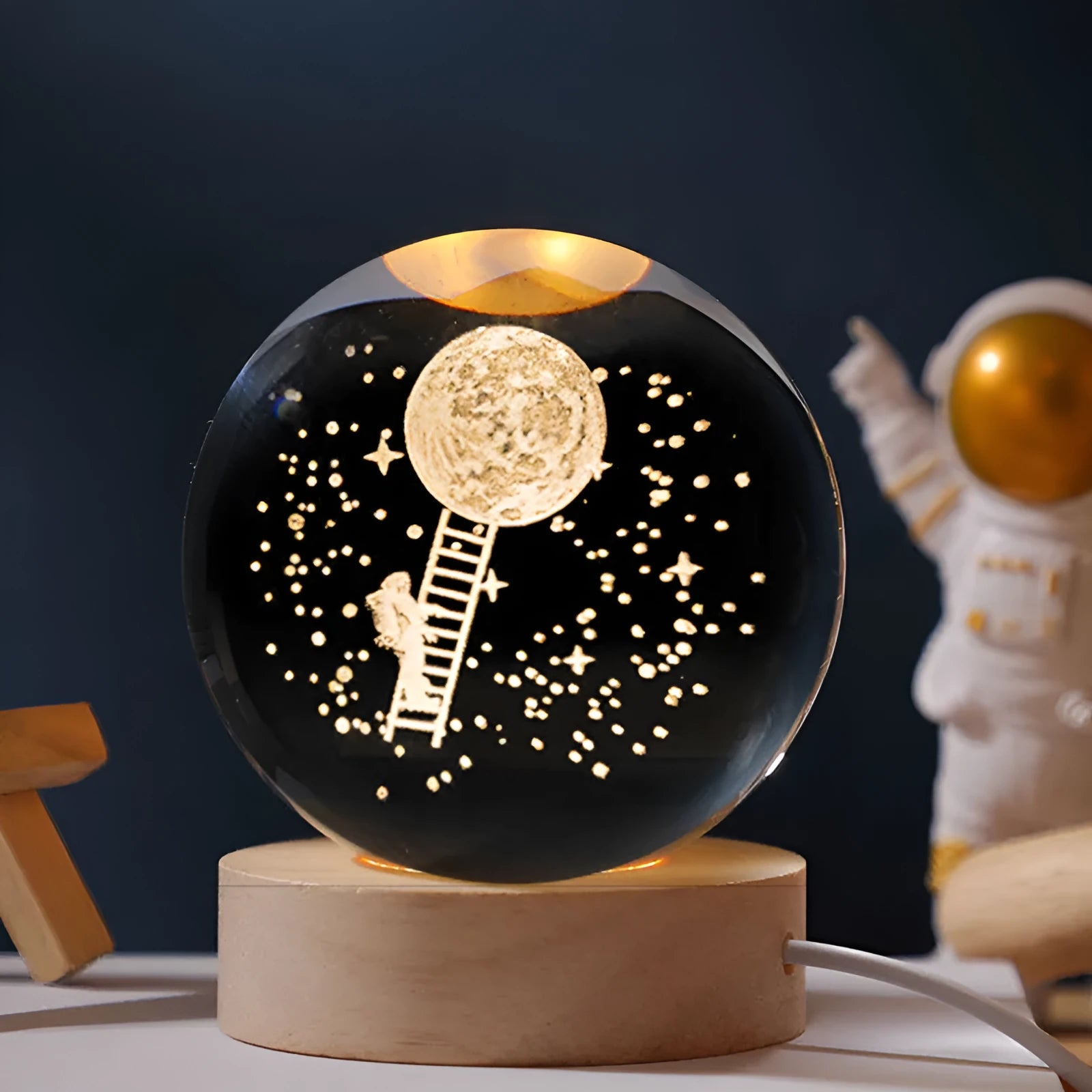 Starry sky luminous crystal ball on a round wooden base, illuminated with soft LED light.