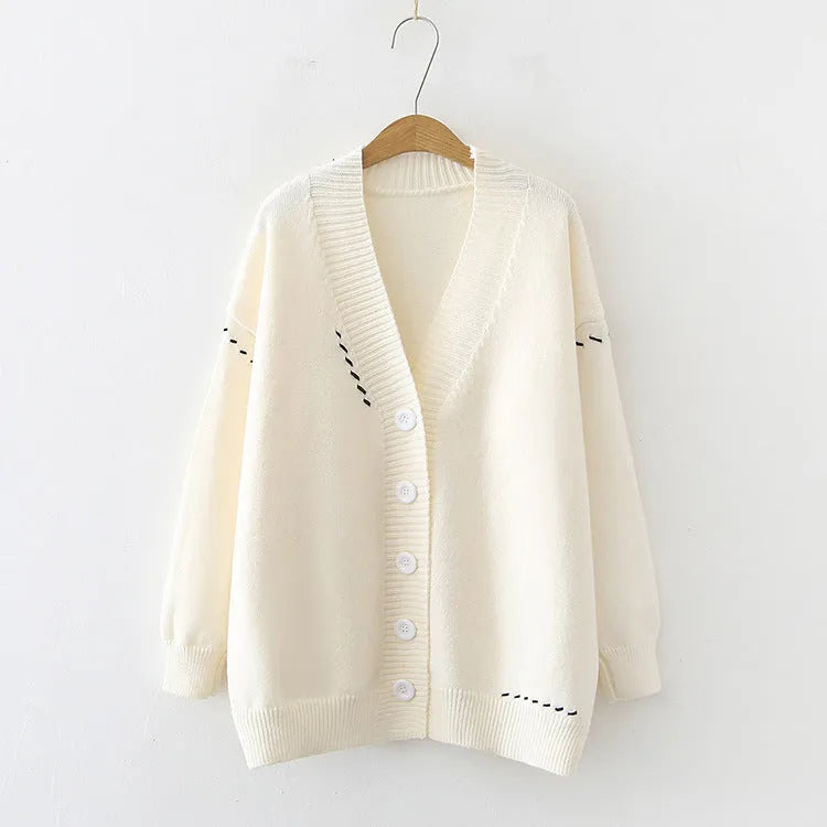 Women's black knitted cardigan coat with long sleeves and loose fit