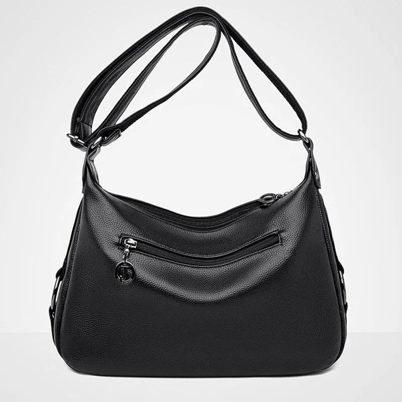 Large blue women's shoulder bag with multiple internal compartments and crossbody strap