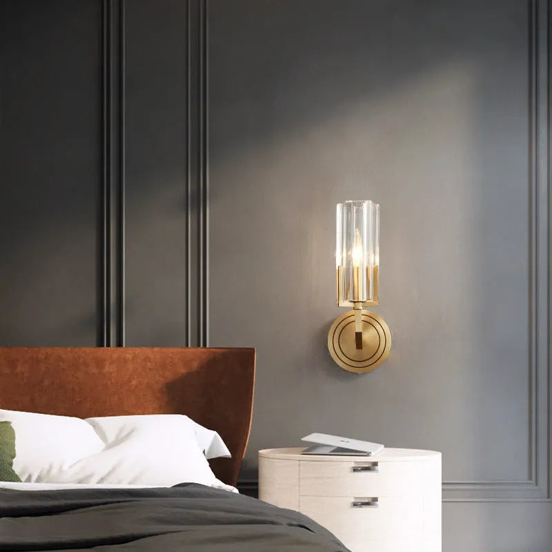 Modern minimalist copper wall lamp with single head design mounted on a wall.