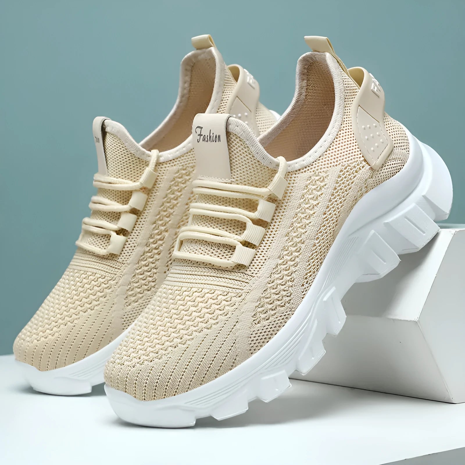 Women's white Flyknit sneakers with thick PVC sole and lace-up front.