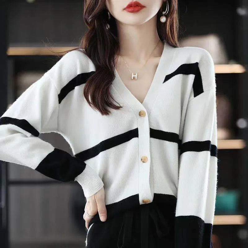 Women's black and white striped V-neck knitted cardigan with a 3D pattern and slim fit.